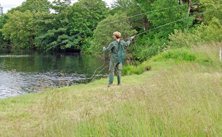 Photo of a fisherman casting in the Forsa river just below the house